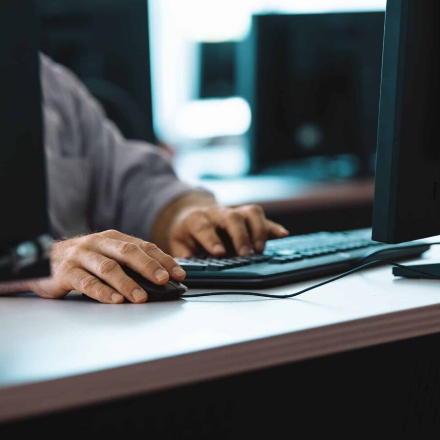 Hands Typing on Keyboard