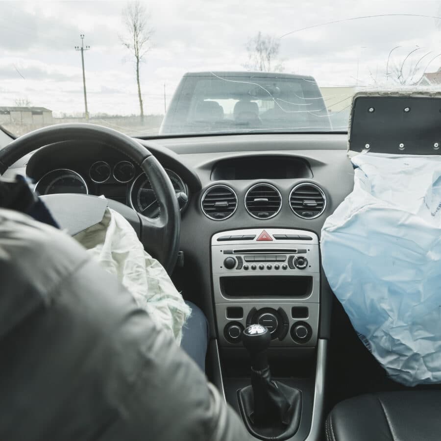 Man in Car with Airbags