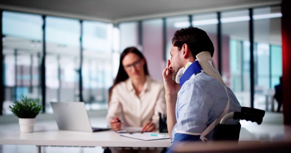 Man Injured talking in an office