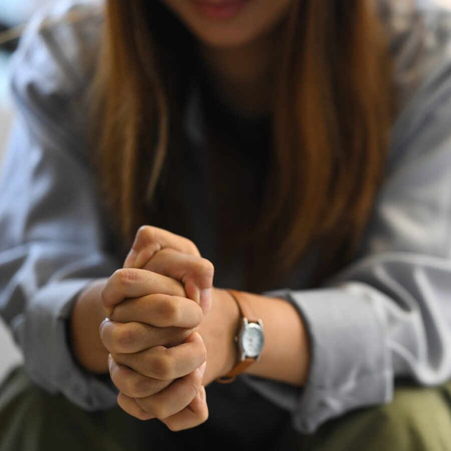 Woman with Hands Clasped